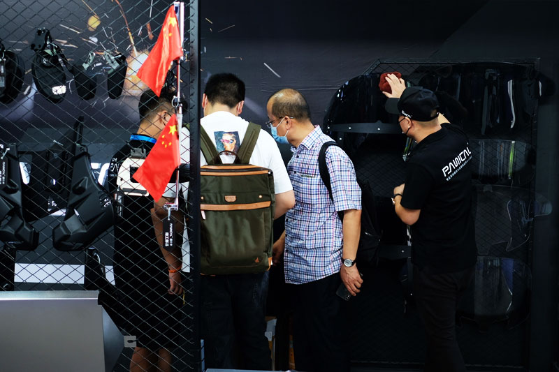 Visitors viewing motorcycle accessories at the PANICAL booth during the 2021 Chongqing Motorcycle Expo